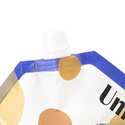 Spout feature for custom flexible packaging