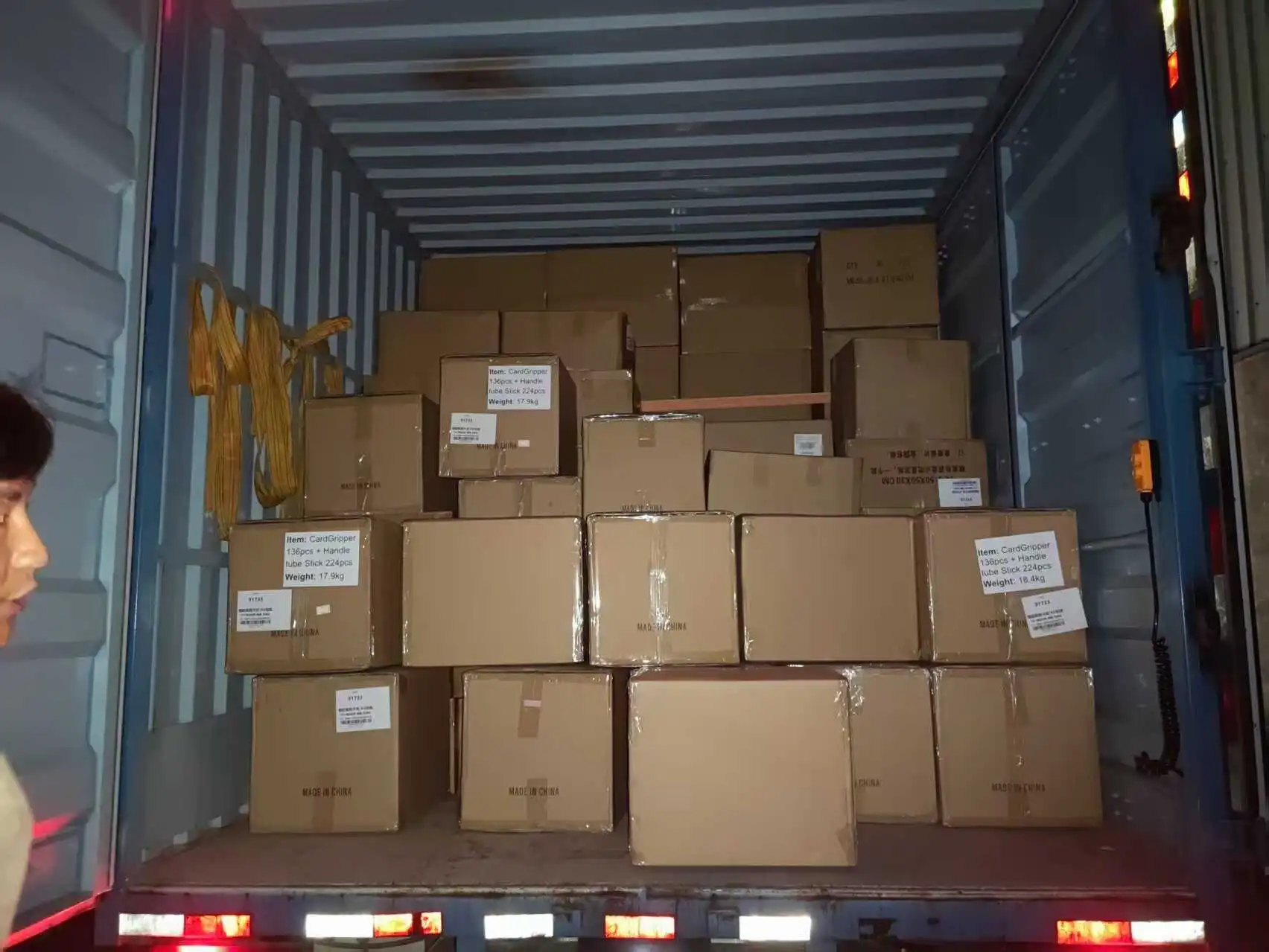 Finished pet-care packaging products being loaded for international shipment to the United States