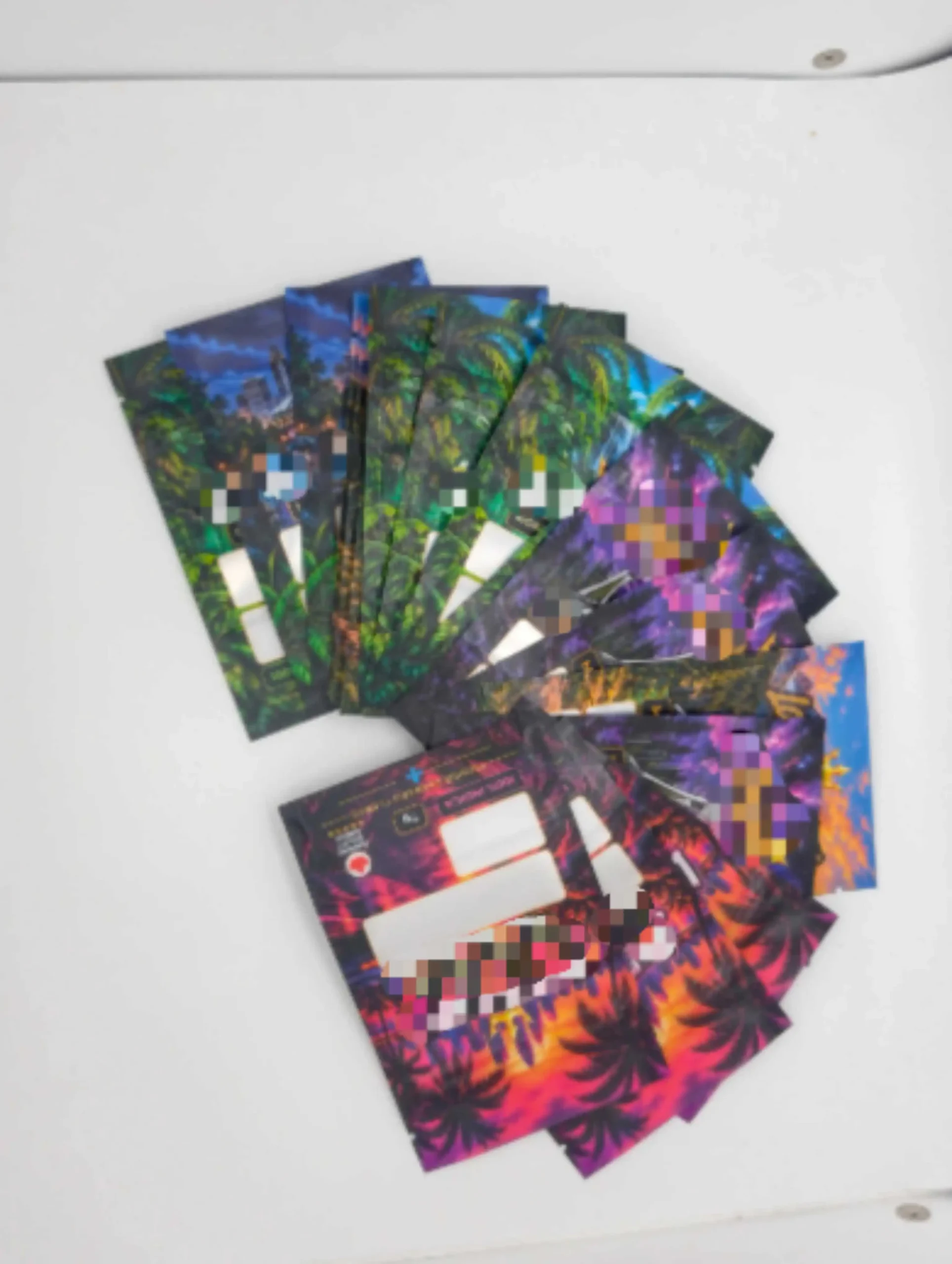 Anonymized custom Mylar pouches in several colorful designs